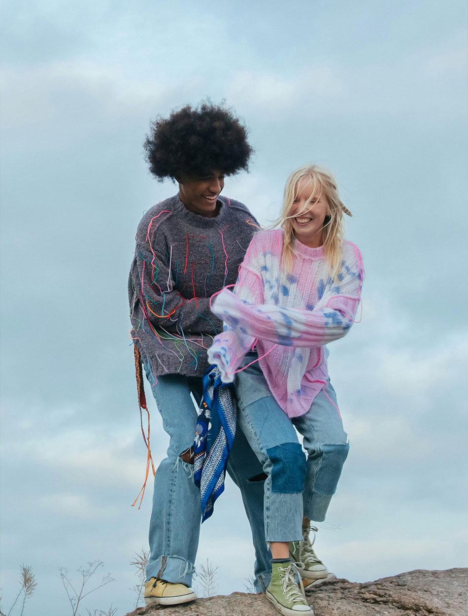 happy-bi-racial-couple-on-rock